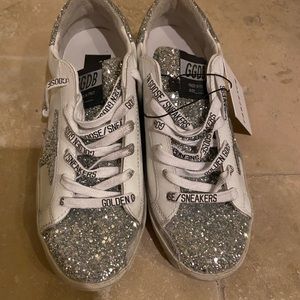 Authentic golden goose deluxe sneakers .